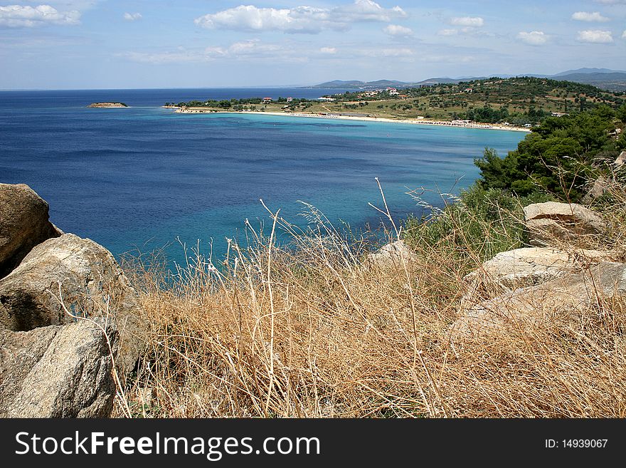 Beautifull coastline with a bay with a sand beach in mediterranean vegetation in Chalkidiki in Greece