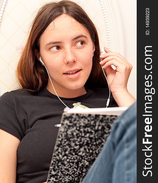 Girl Listening to Music While Studying. Girl Listening to Music While Studying