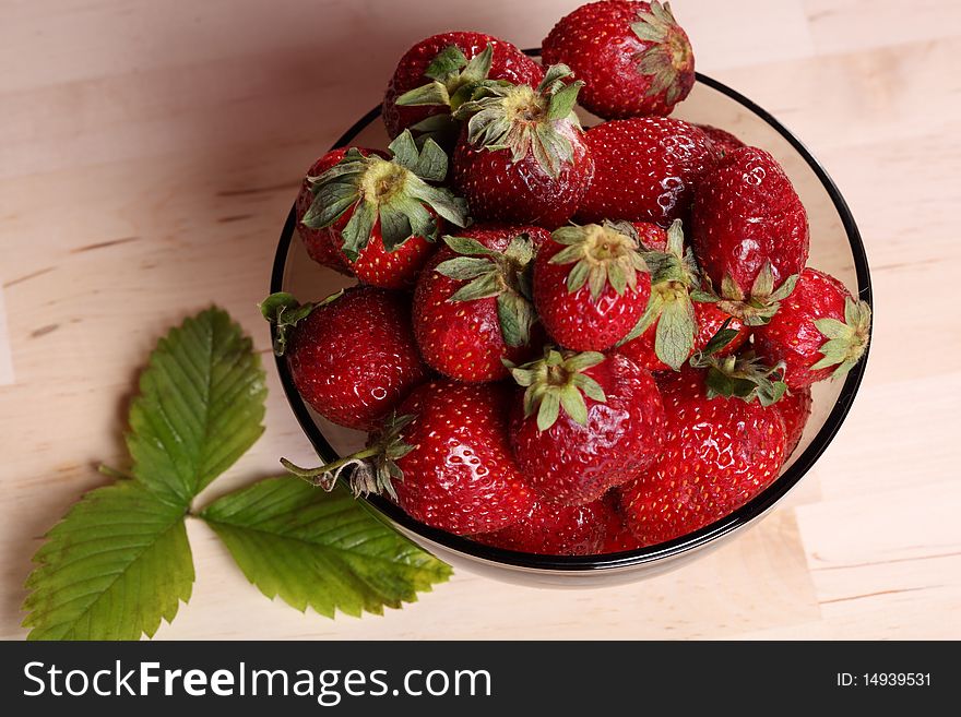 Close-up view of the bowl with fresh strawberry. Close-up view of the bowl with fresh strawberry