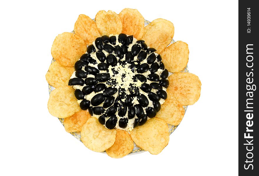 Salad in the form of a sunflower in a cup, potato chips, black olives, egg yolk powder