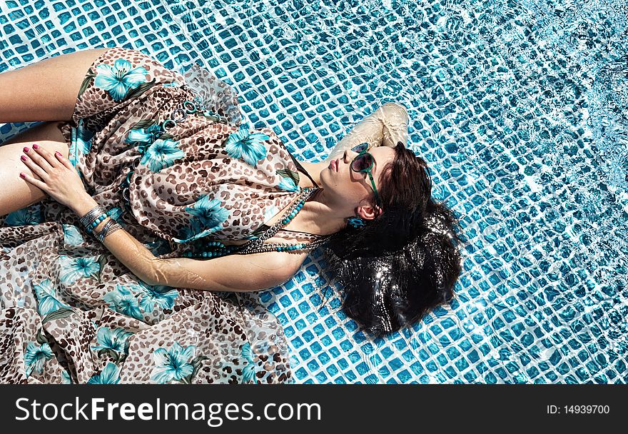 Young Woman At A Pool