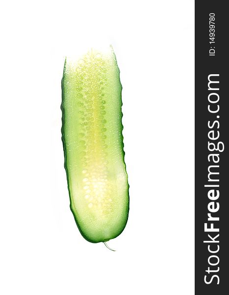 Ripe juicy green cucumber on a white background