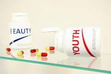 Free Youth And Beauty Pills In A Bottle Stock Photography - 14944982