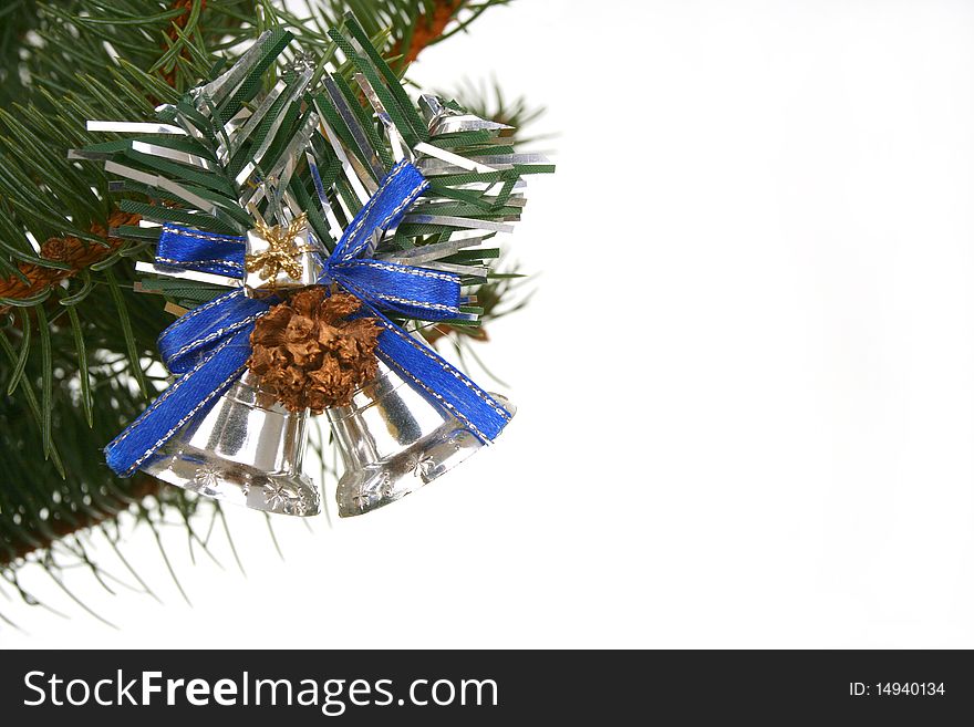 Silver bells on branch fir on white background
