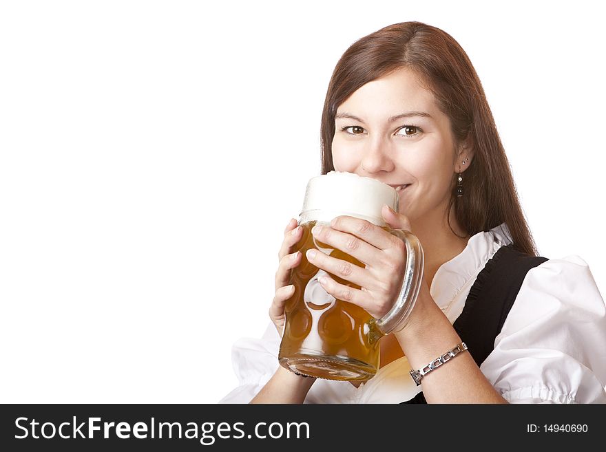 Beautiful woman in dirndl cloth holds Oktoberfest beer stein.Isolated on white background.