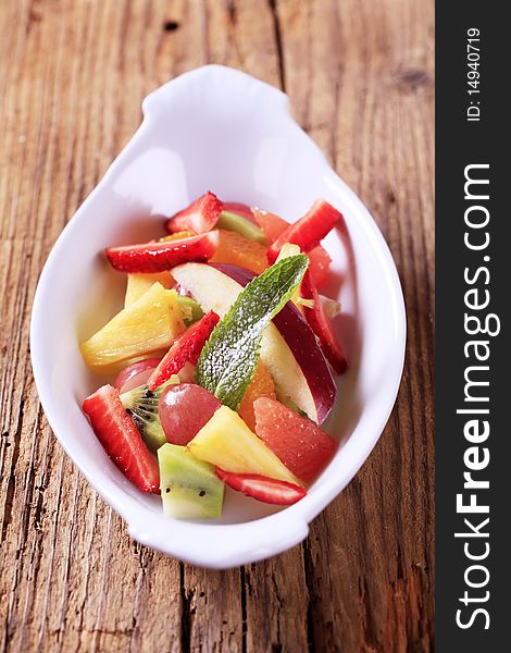 Bowl of fresh mixed fruit salad - detail