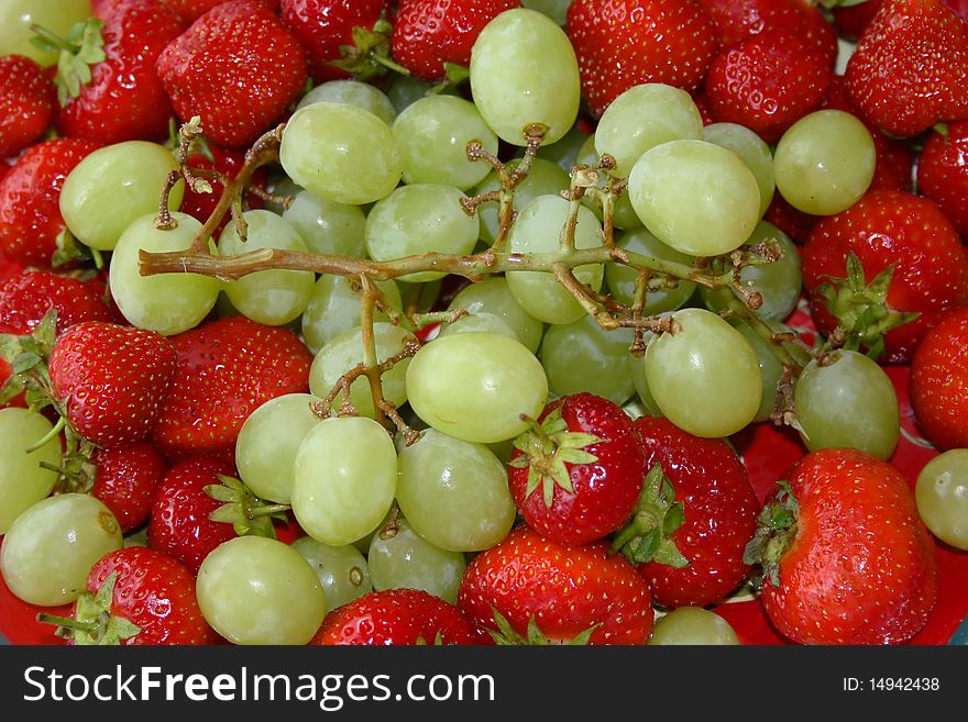 Fresh healthy strawberries and grapes. Fresh healthy strawberries and grapes