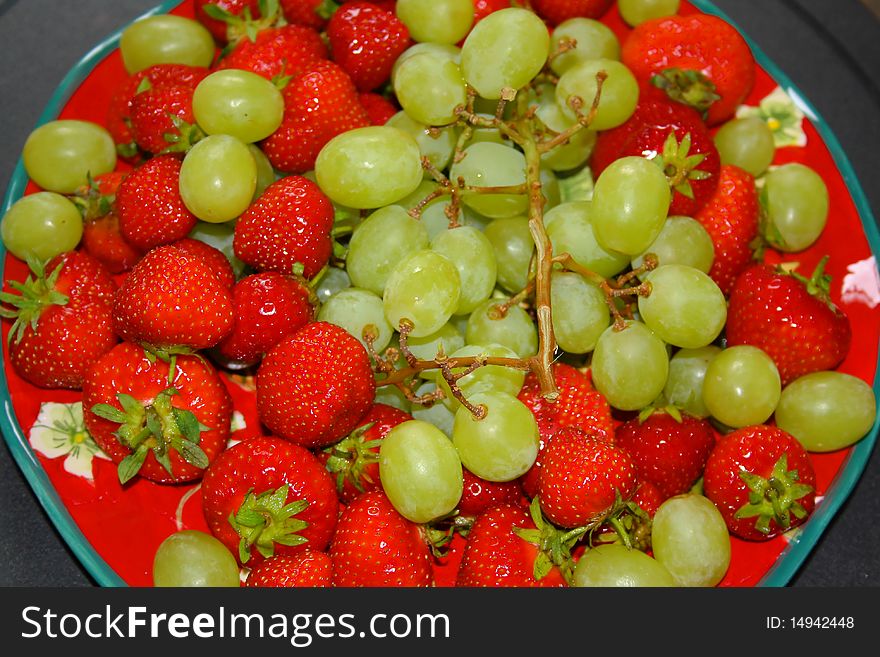 Fresh healthy strawberries and grapes. Fresh healthy strawberries and grapes