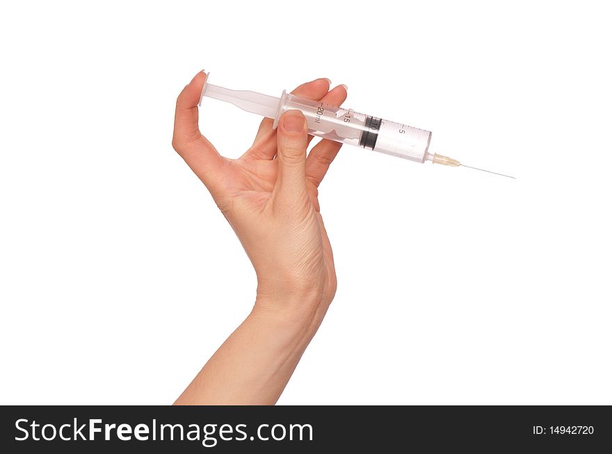Syringe in the woman's hand for making injections