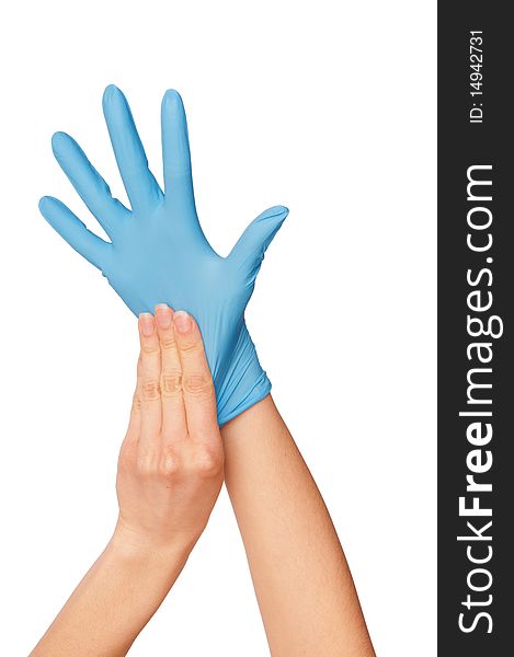 Doctor putting on blue sterilized medical glove for making operation