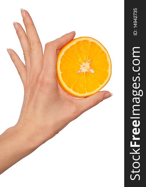 Slice of a fresh Sicilian orange in the hand