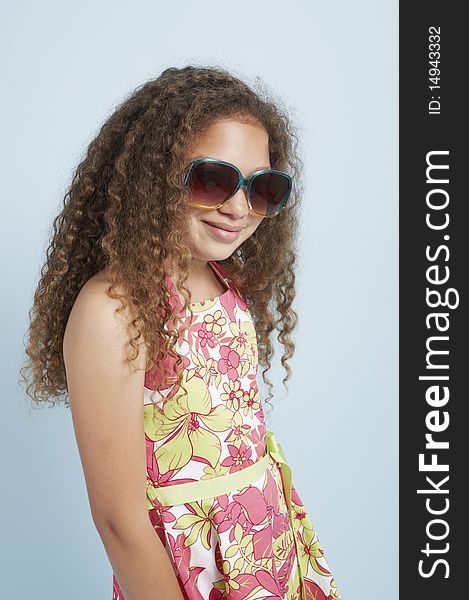 Mixed race young girl wearing sunglasses. Mixed race young girl wearing sunglasses