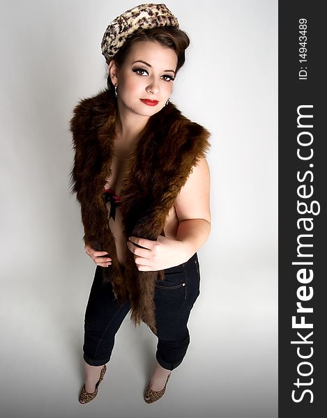 woman wearing fur stole and vintage animal print hat. woman wearing fur stole and vintage animal print hat