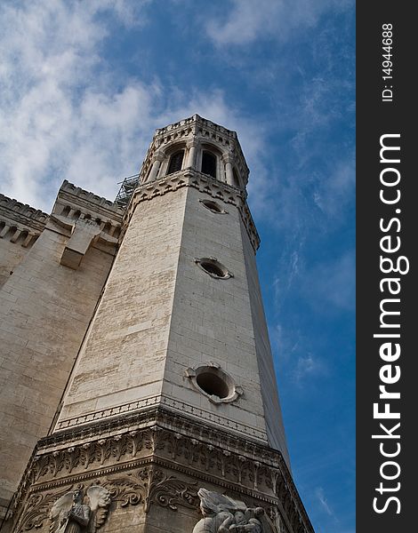 A tower in Lyon cathedral with the blue sky