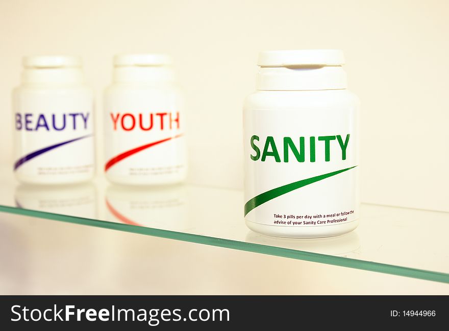 Sanity, Beauty and Youth pills in a bottle on bathroom shelf with focus on Sanity, fake brands