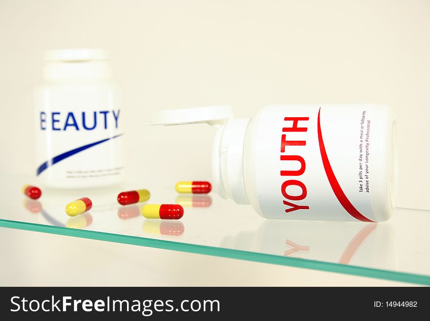 Youth and beauty pills in a bottle on bathroom shelf, fake brands