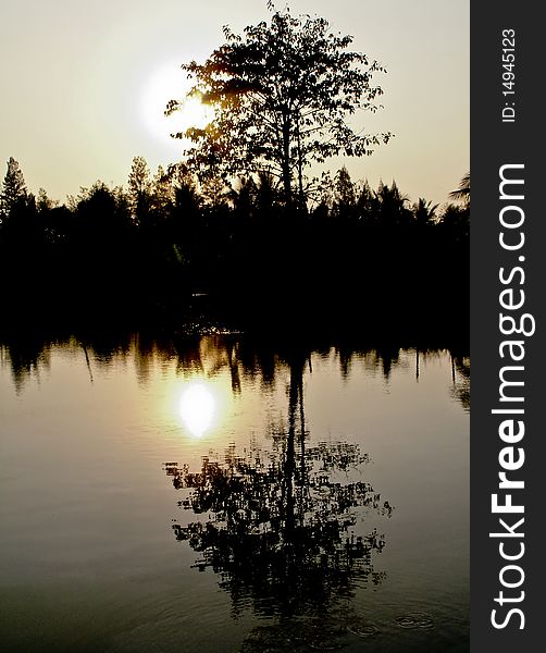 Golden sunset over the lake on the east coast of Thailand