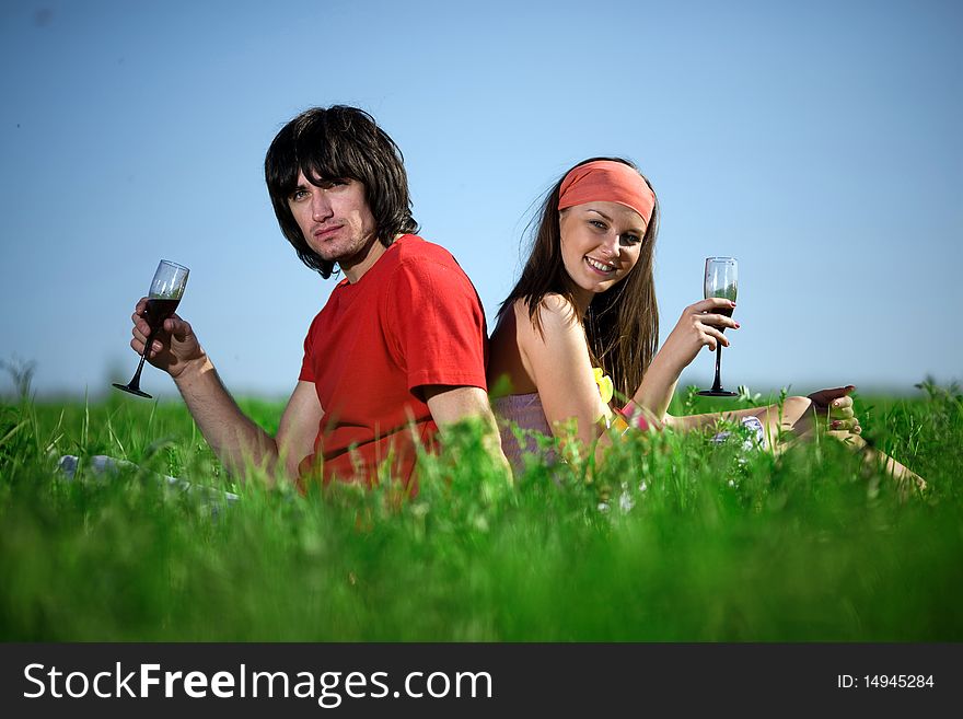 Nice girl with smile and boy with wineglasses. Nice girl with smile and boy with wineglasses