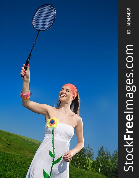 Smiling girl in white dress with racket. Smiling girl in white dress with racket