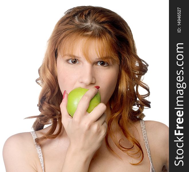 A beautiful young woman biting a fresh green apple. A beautiful young woman biting a fresh green apple.