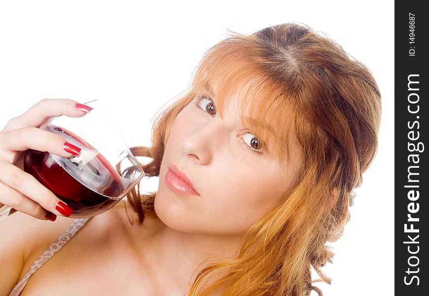 Healthy redhead young woman holding glass of red wine