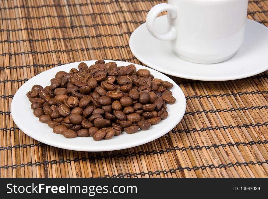 Beans and cup of coffee