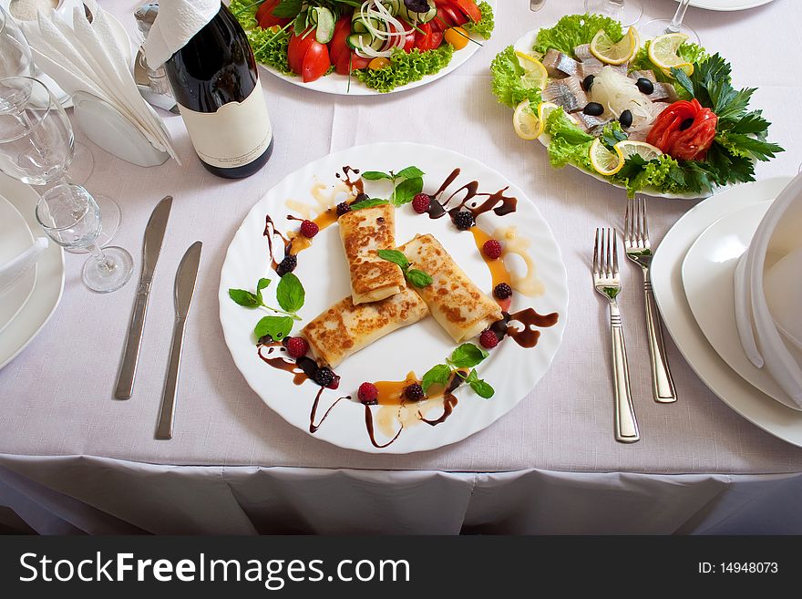 Celebratory table with tasty dishes set for a dinner