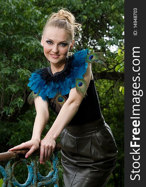 Portrait Of Girl In Blouse With Peacock Feathers