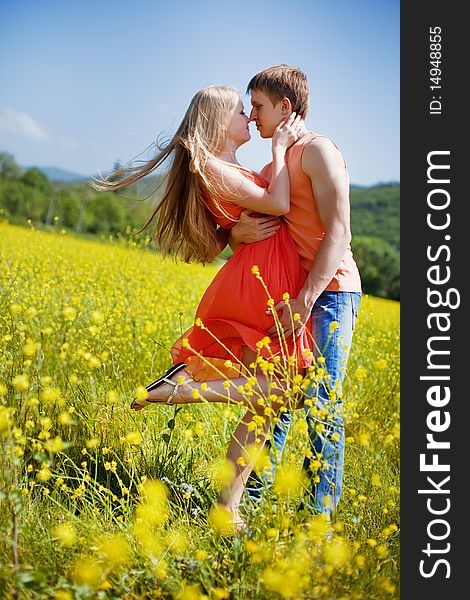 Pretty young couple in the fields