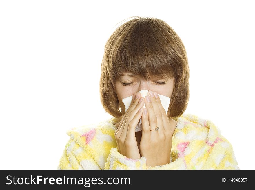 Woman in dressing gown holding a handkerchief around his nose. Isolated on white background. Woman in dressing gown holding a handkerchief around his nose. Isolated on white background