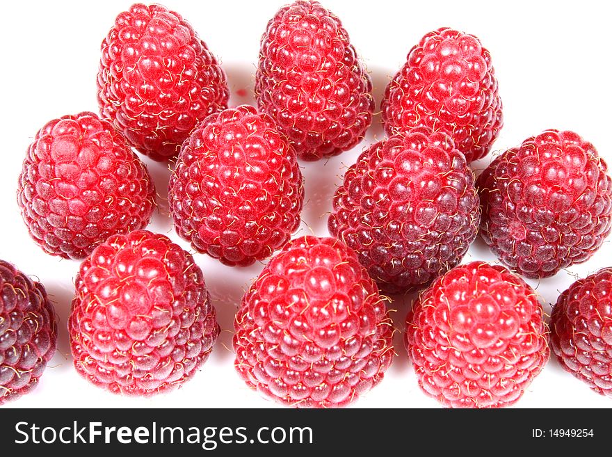 A group of big fresh raspberries over white. A group of big fresh raspberries over white