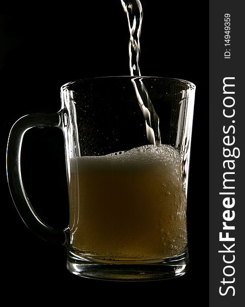 Cider being poured into pint glass