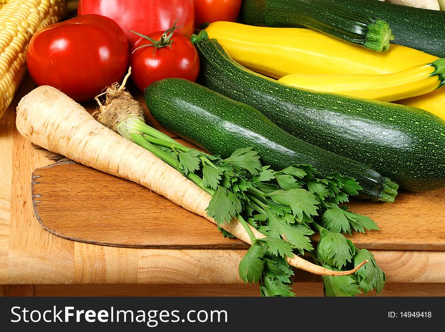 Whole fresh vegetables on wooden board. Bumper crop. Whole fresh vegetables on wooden board. Bumper crop