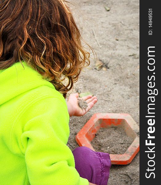 Little girl with fleece plaing on the beach. Little girl with fleece plaing on the beach