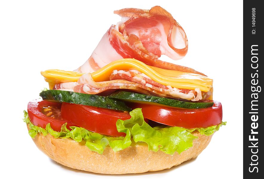 Sandwich with ham and vegetables on white background