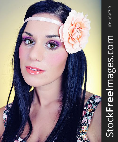 Retro portrait in 70's style of beautiful woman with artistic make-up