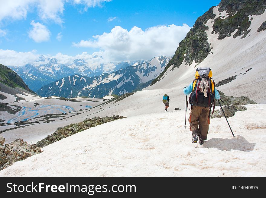 Hiker family in Caucasus mountains