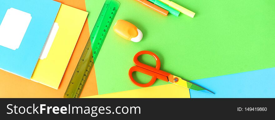 Back to school background. School supplies bright colors