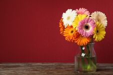 Bouquet Of Beautiful Bright Gerbera Flowers In Vase On Wooden Table Against Color Background Stock Images