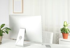 Office Interior With Houseplants And Computer Monitor Royalty Free Stock Images