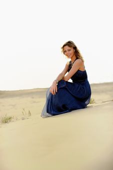 Beautiful Woman Sitting On The Beach In A Sand Royalty Free Stock Image Beautiful Woman Sitting On The Beach In A Sand Royalty Free Stock Image