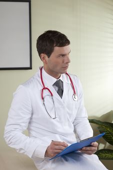 Male Doctor With Paperwork Stock Image Male Doctor With Paperwork Stock Image