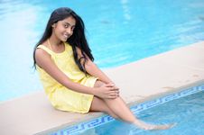 Girl Sitting At Pool Royalty Free Stock Photo