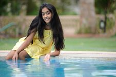 Girl Sitting At Pool Royalty Free Stock Photography