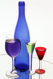 Dark Blue Bottle And Three Wine-glasses Royalty Free Stock Photography Dark Blue Bottle And Three Wine-glasses Royalty Free Stock Photography