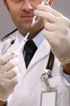 Doctor With Medical Syringe In Hands Stock Photography