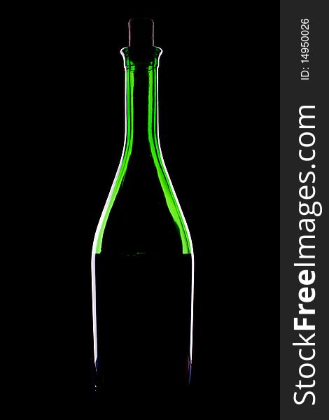 Green glacc bottle of wine and wineglass on black background