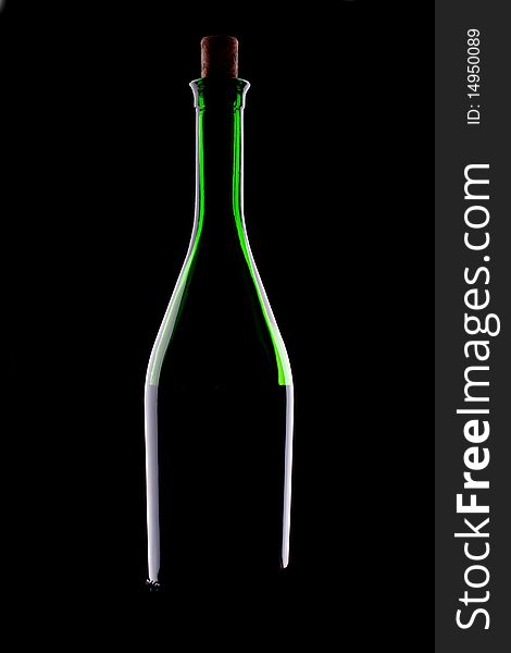 Green glacc bottle of wine and wineglass on black background