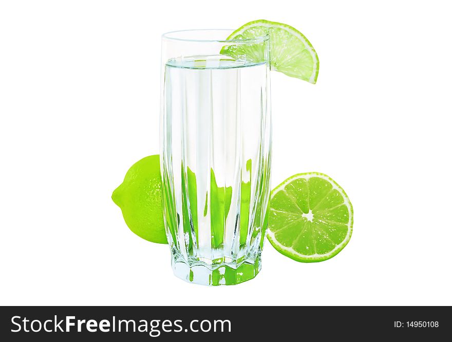 Glass of water with lime isolated on a white background