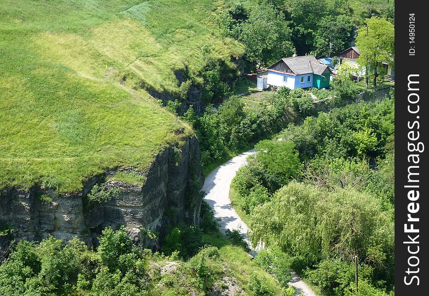 House in the green near the low cliffs.